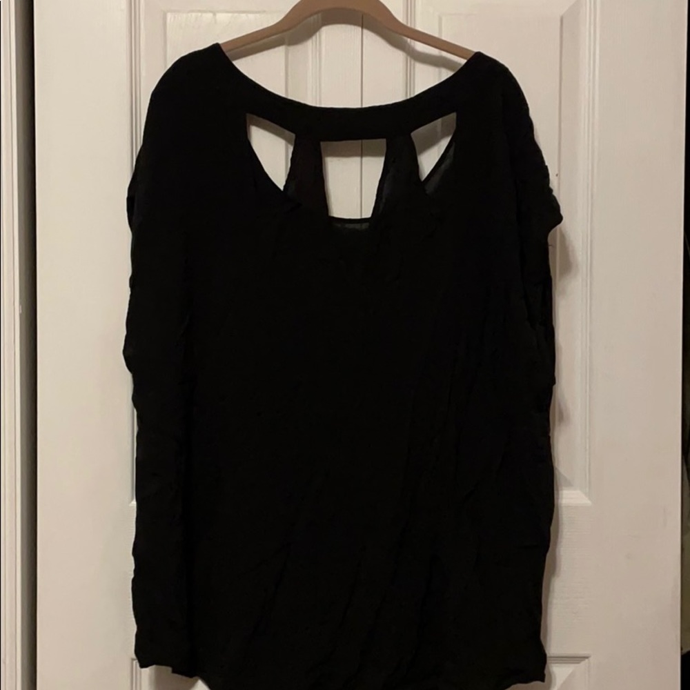 Torrid 2 black silkish top. Cute with belt!